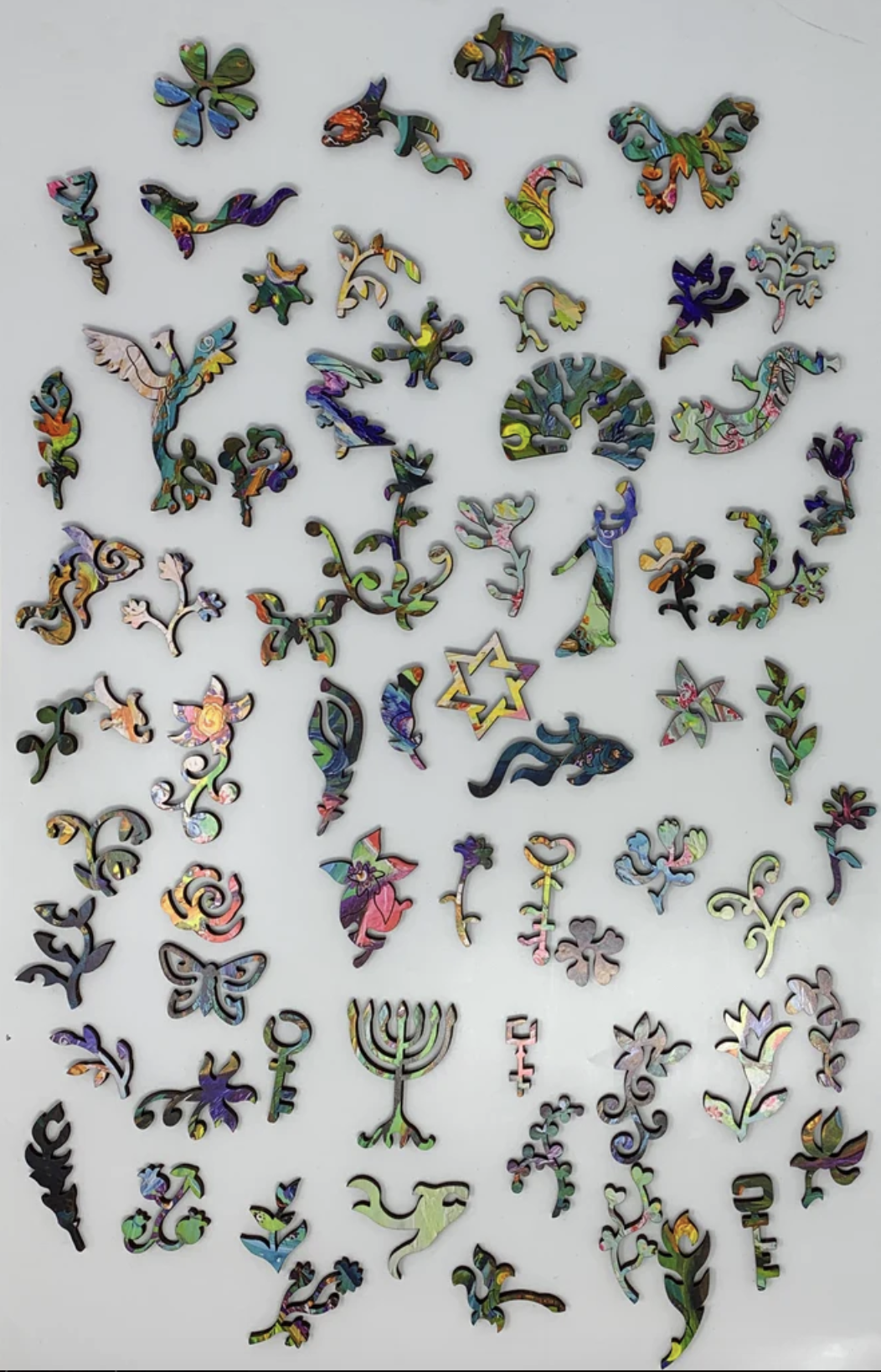 A colorful, highly detailed jigsaw puzzle featuring a stylized snake and a peacock in an intricate, patterned design.
Photo by Nautilus Puzzles [additional_image_link]