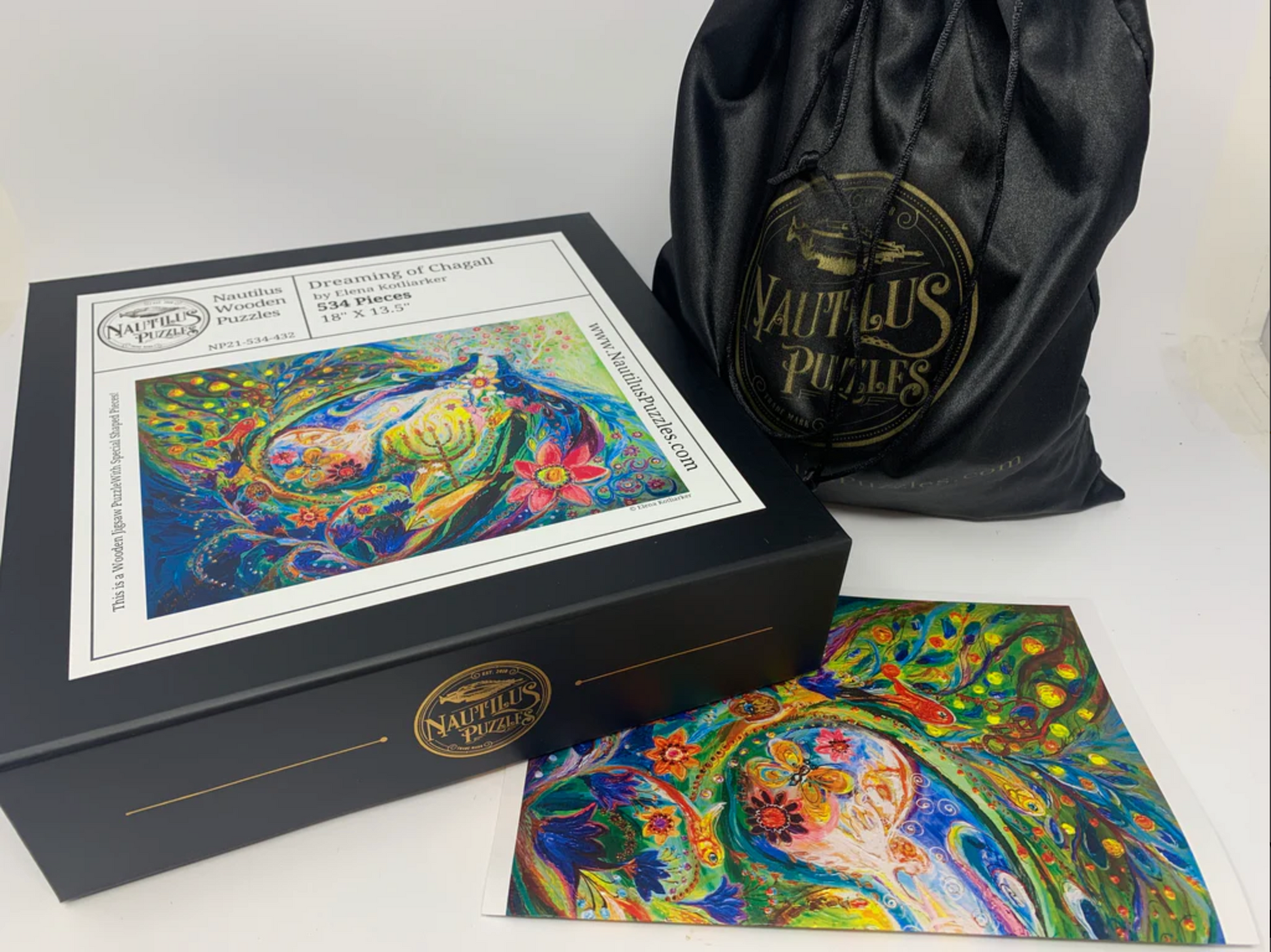 A colorful, highly detailed jigsaw puzzle featuring a stylized snake and a peacock in an intricate, patterned design.
Photo by Nautilus Puzzles [additional_image_link]