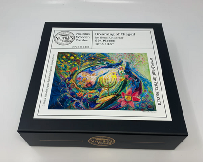 A colorful, highly detailed jigsaw puzzle featuring a stylized snake and a peacock in an intricate, patterned design.
Photo by Nautilus Puzzles [additional_image_link]