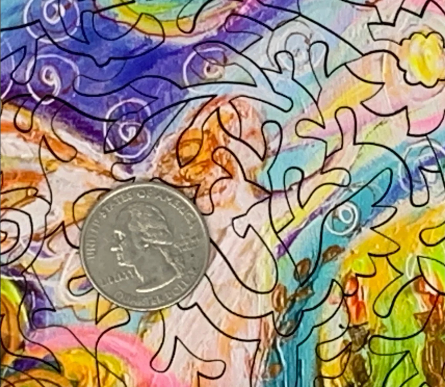 A colorful, highly detailed jigsaw puzzle featuring a stylized snake and a peacock in an intricate, patterned design.
Photo by Nautilus Puzzles [additional_image_link]