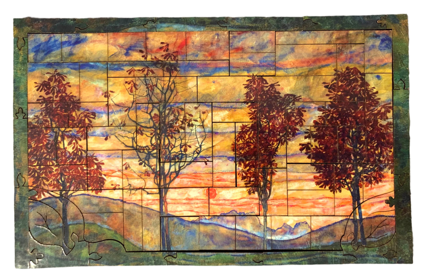 A jigsaw puzzle depicting a vibrant painting of four trees against a sunset background, with a cloudy sky in the background.
Photo by Karen King [additional_image_link]