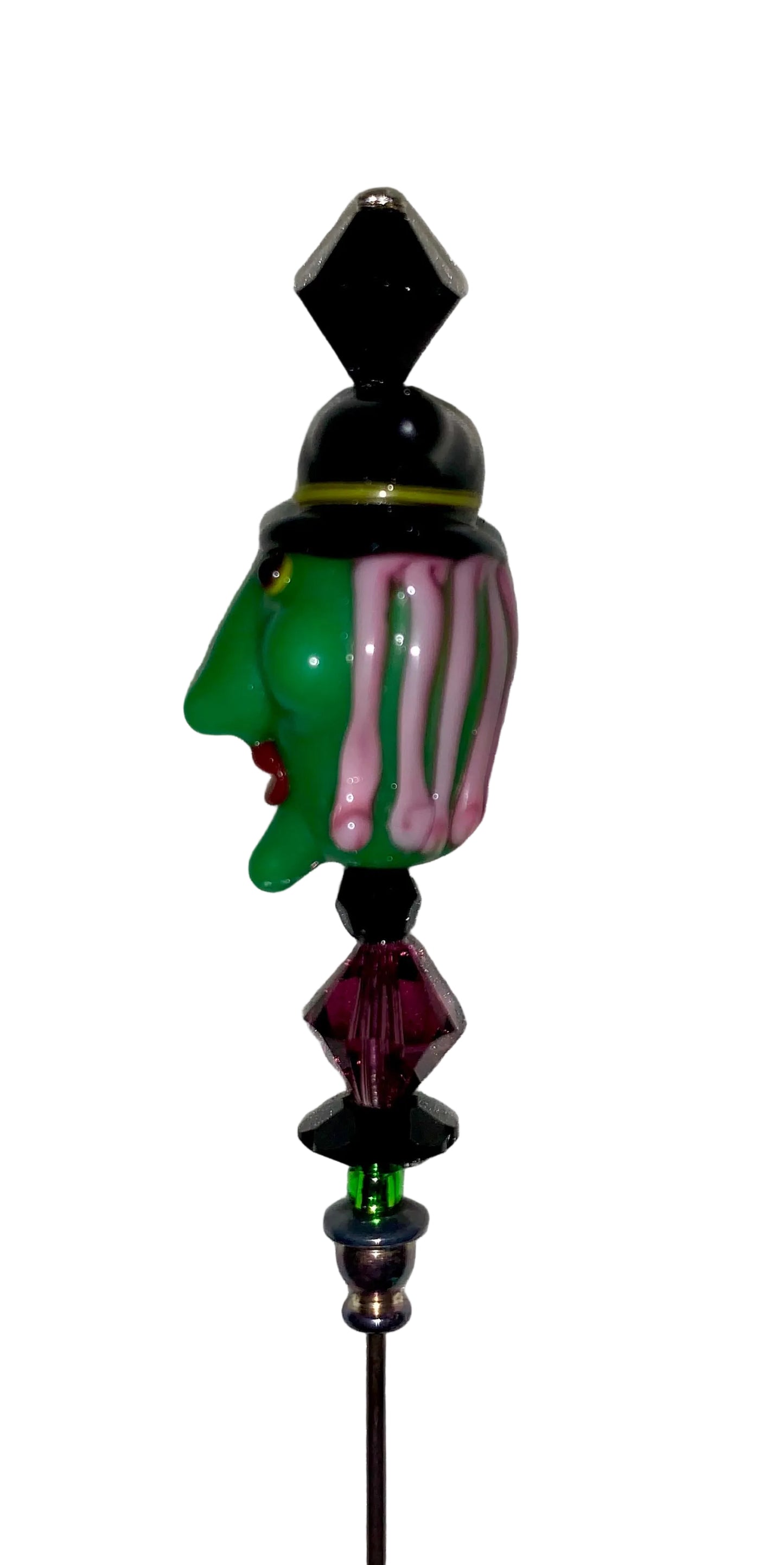Green witch head with black hat, red lips and pink hair, purple and green and black beads on a 5" hat pin.
[additional_image_link]