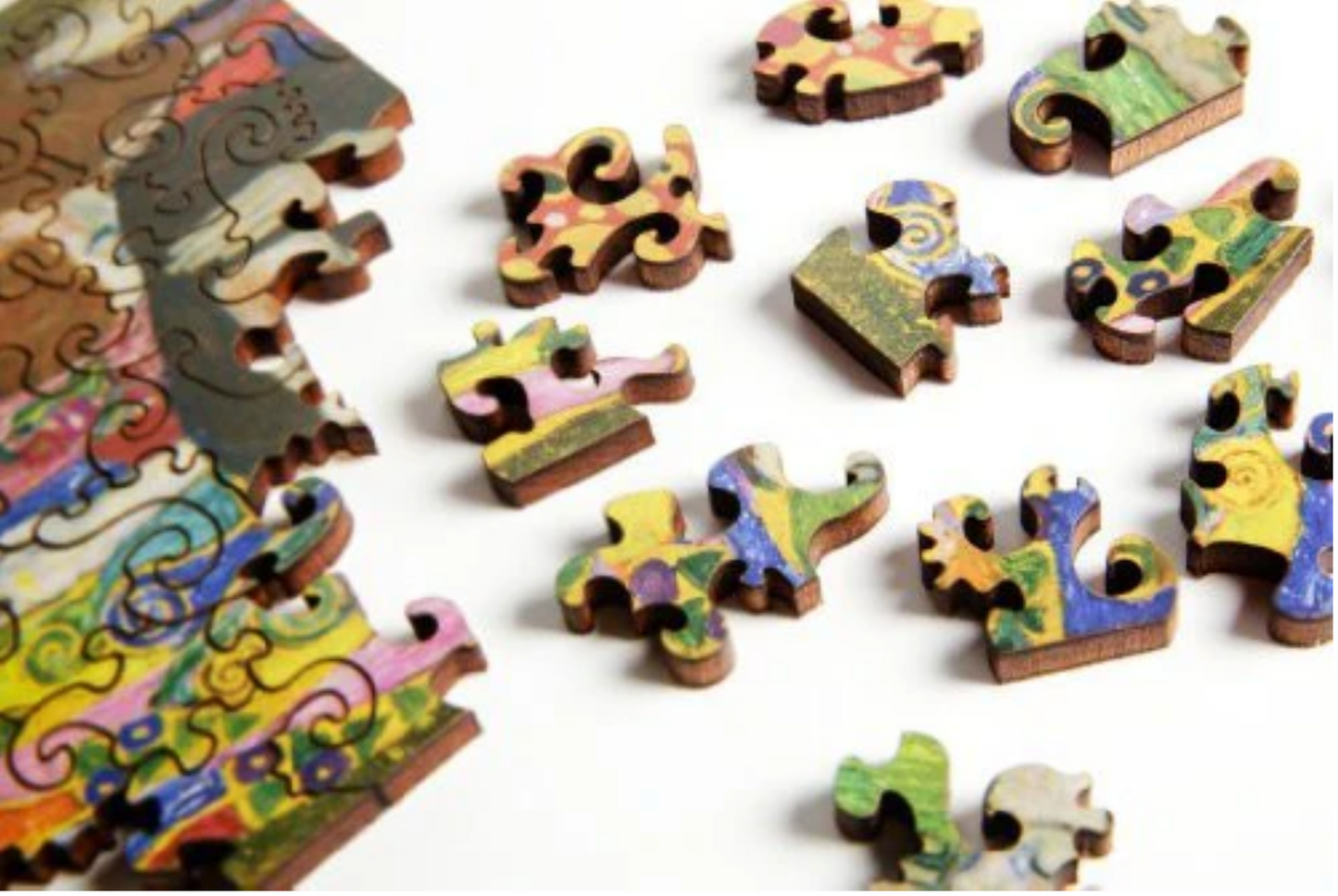 A jigsaw puzzle featuring a colorful artistic design, a depiction of a pregnant female figure with ornate details and a vibrant backdrop.
Photo by Artifact Puzzles [additional_image_link]