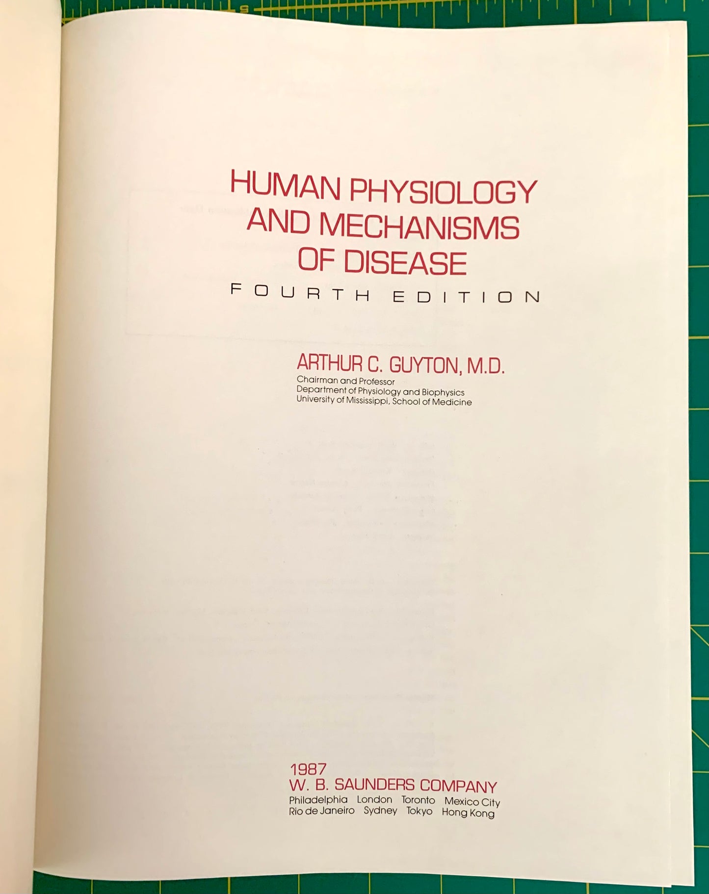 An open book showing the title page of 'Human Physiology and Mechanisms of Disease, Fourth Edition' by Arthur C. Guyton, M.
[additional_image_link]