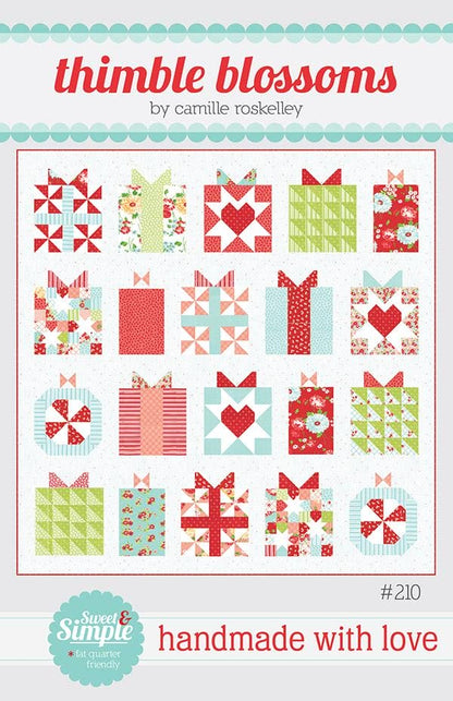 Pattern cover for 'thimble blossoms' quilt by camille roskelley, showing a grid of red, green, and white quilted gift box and heart motifs, with 'handmade with love' at the bottom.
Photo by Thimble Blossoms [image_link]