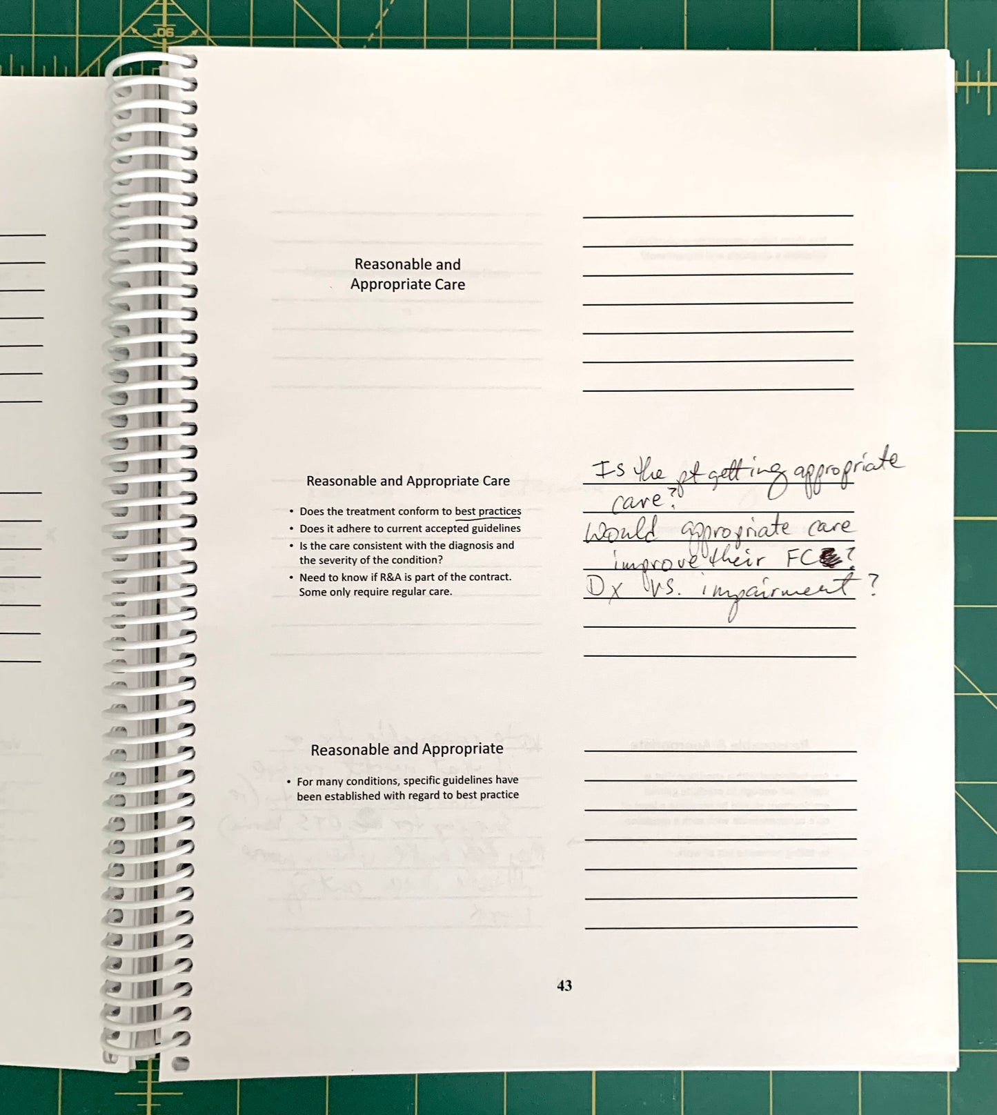 An open spiral-bound notebook showing handwritten notes and printed text pages, photographed on a green cutting mat background.
[additional_image_link]