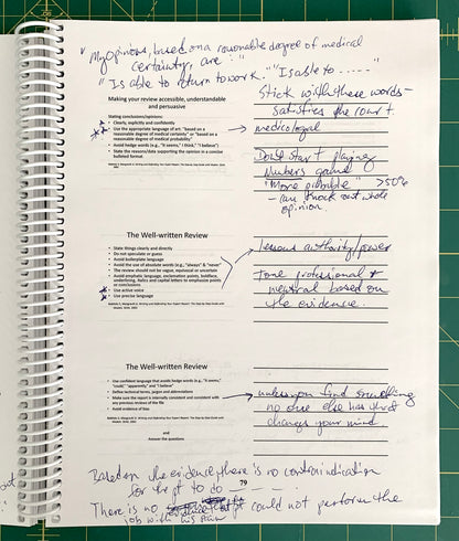 An open spiral-bound notebook showing handwritten notes and printed text pages, photographed on a green cutting mat background.
[additional_image_link]