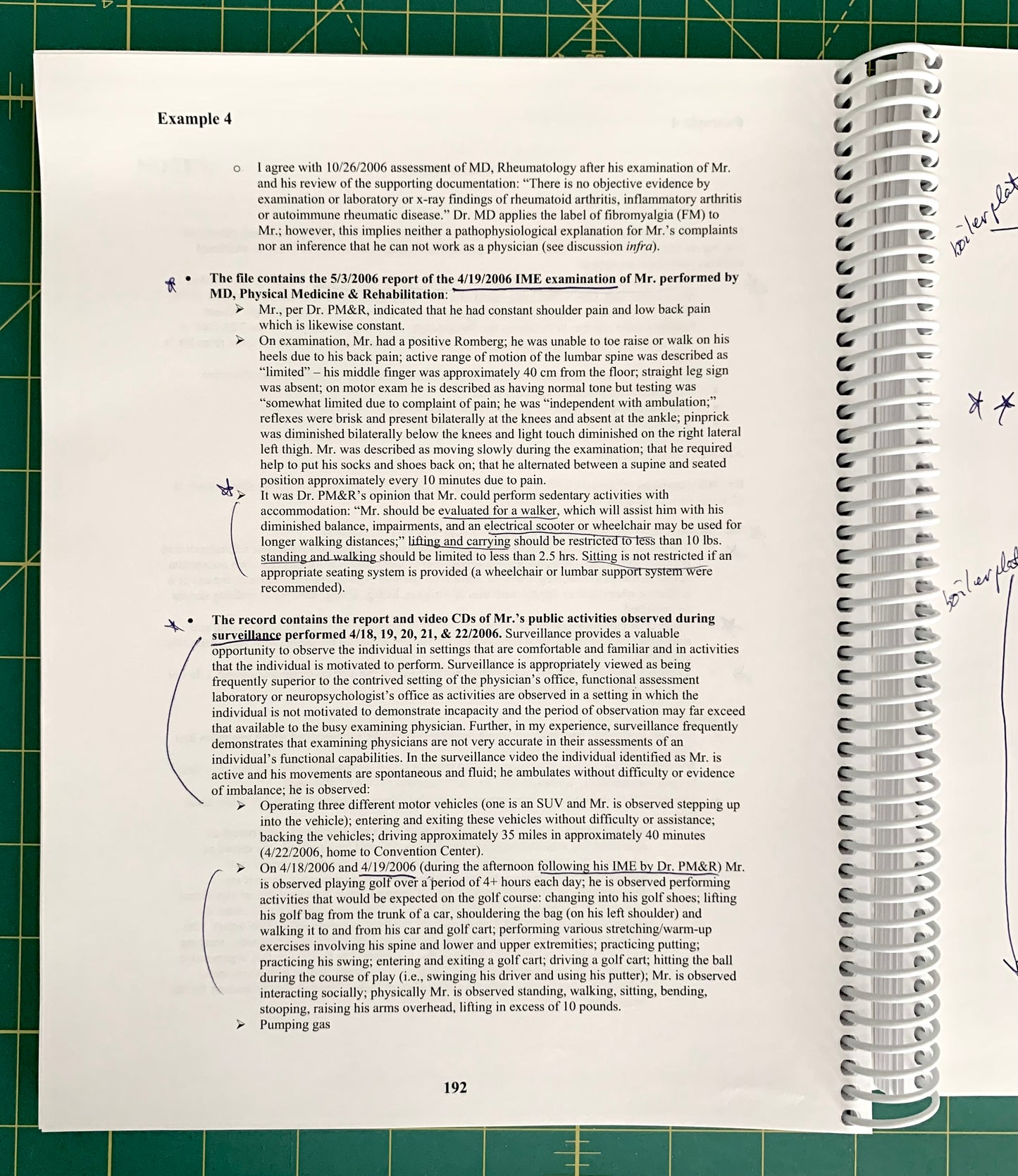 An open spiral-bound notebook showing a printed page with text and handwritten notes, placed on a green cutting mat background.
[additional_image_link]
