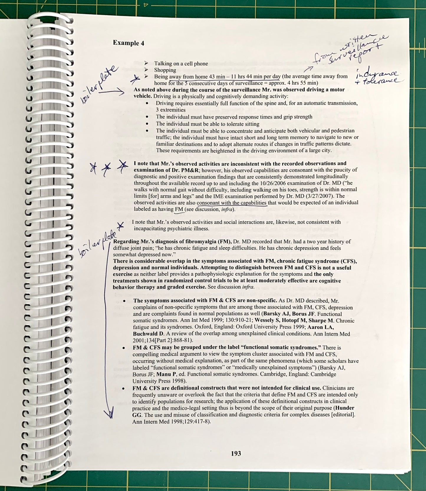 A spiral-bound notebook page showing a handwritten medical case study titled 'Example 4' with printed text and blue ink notes, placed on a green cutting mat.
[additional_image_link]