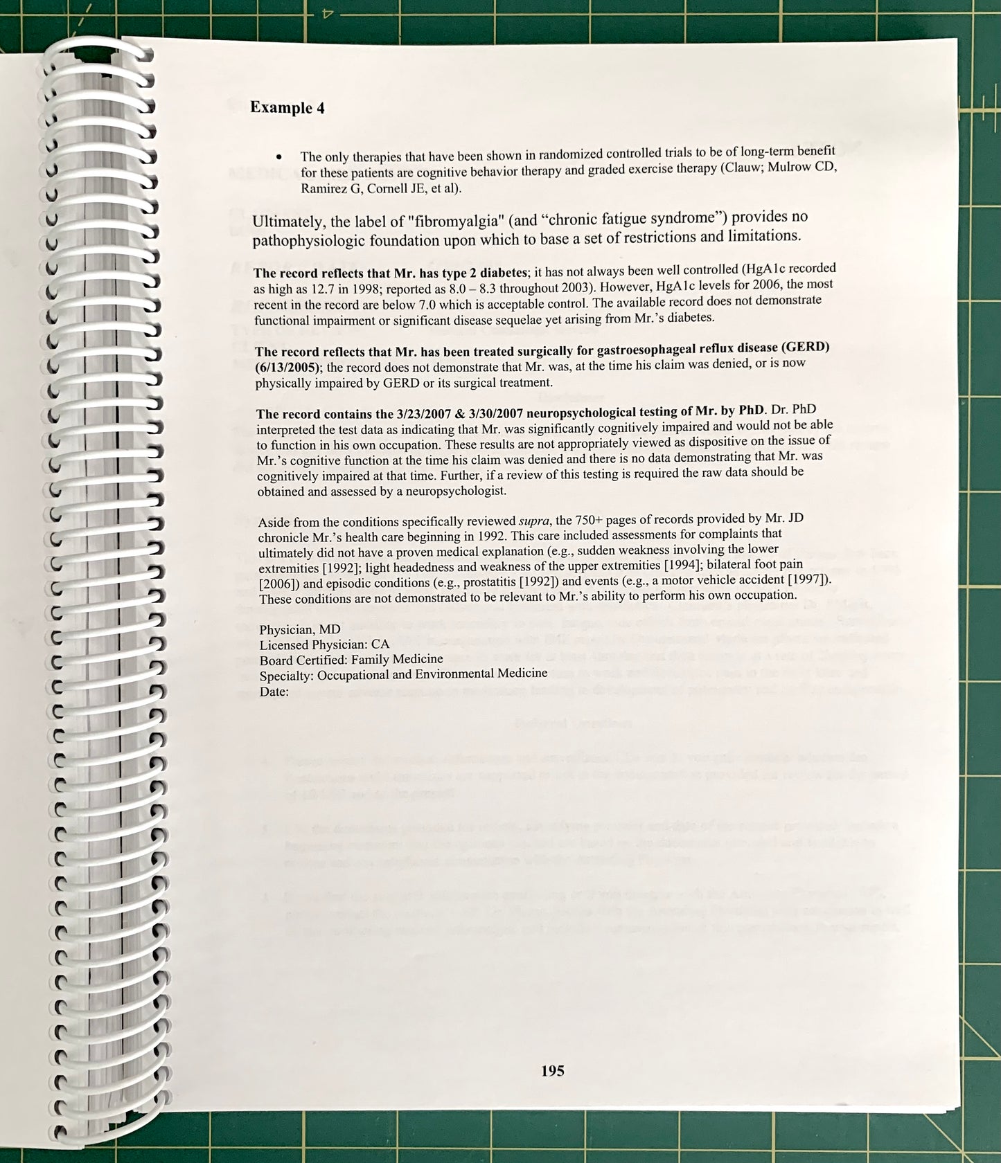 A spiral-bound notebook page showing a medical case study excerpt titled 'Example 4' with multiple paragraphs of text, photographed on a green cutting mat background. 
[additional_image_link]