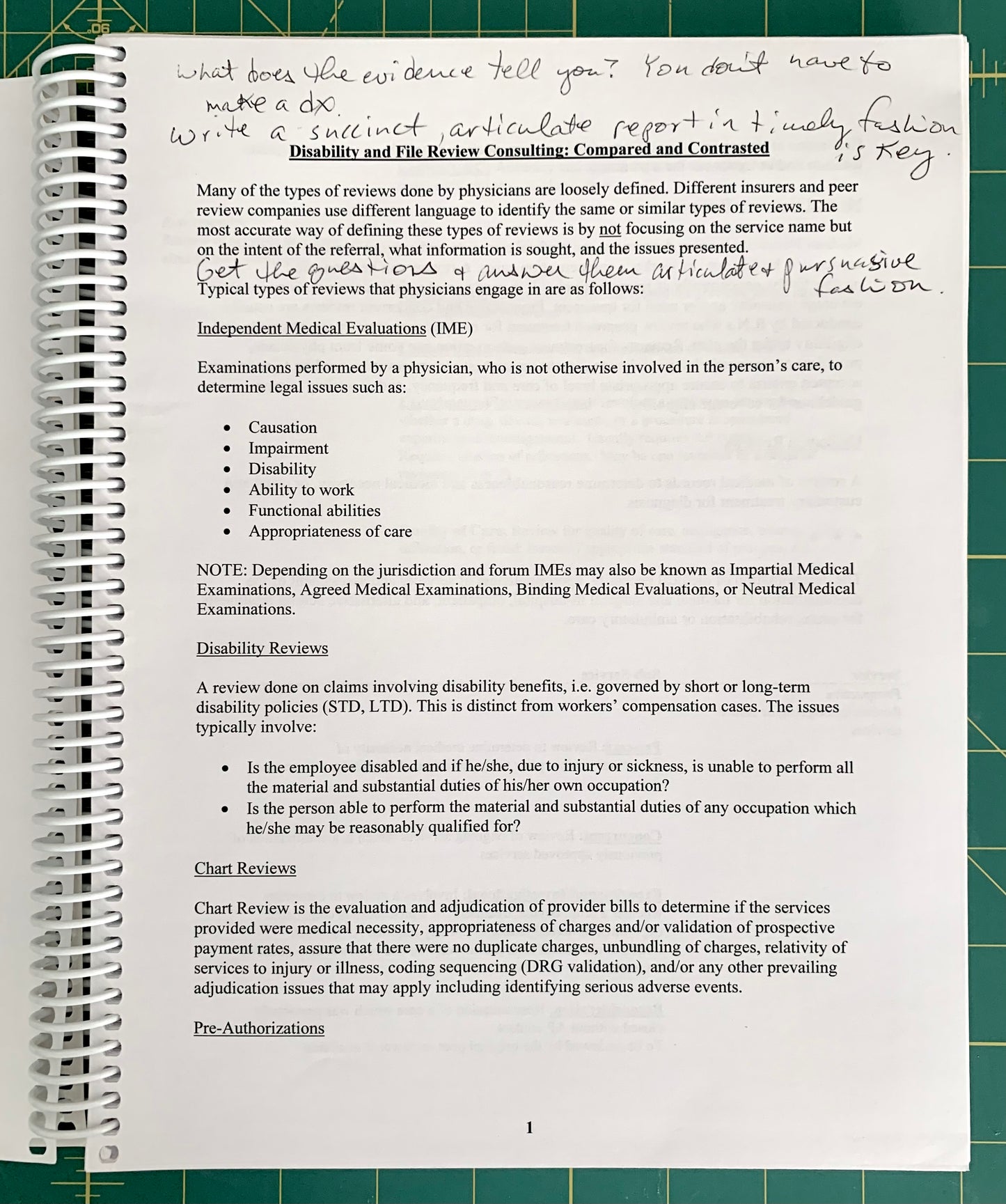 An open spiral-bound notebook showing handwritten notes and printed text pages, photographed on a green cutting mat background.
[additional_image_link]