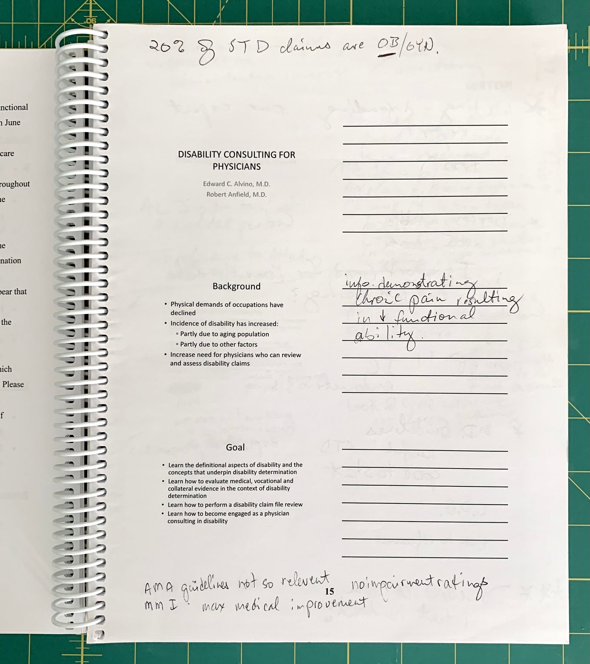 A spiral-bound notebook page with printed text about disability consulting for physicians and handwritten notes, photographed on a green cutting mat.
[additional_image_link]
