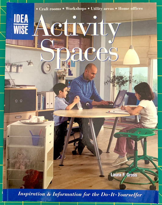 Front cover of the book 'Activity Spaces' by Laura F. Gross, featuring a family working at a table in a home office setting, with the 'IDEA WISE' brand logo in the top left corner.
[image_link]
