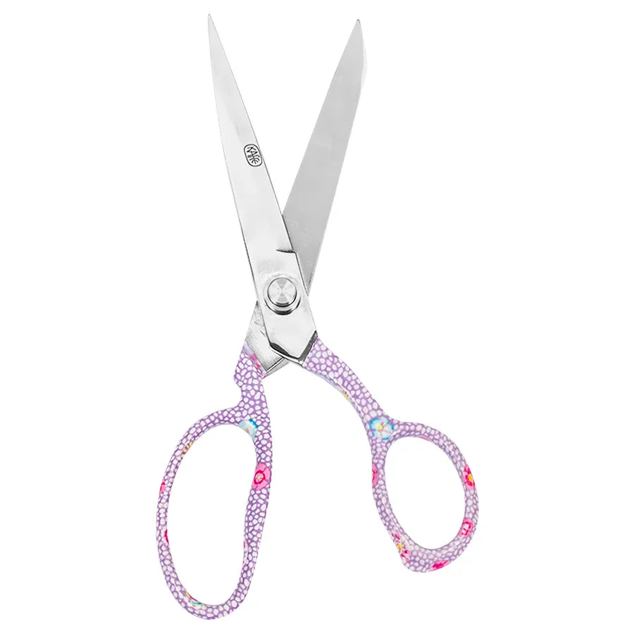 Silver scissors with light purple crystal-embellished handles, shown on a plain white background.
Photo by Kaffe Fassett [additional_image_link]