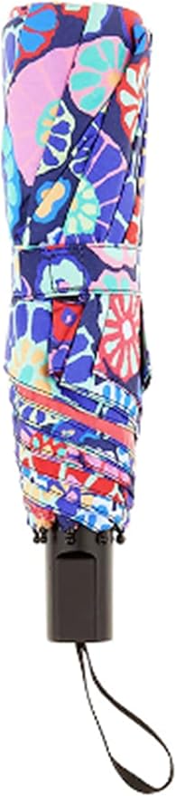 A compact umbrella shown closed, featuring a vibrant multicolor floral pattern with pink, blue, purple, and red tones, with a black handle and wrist strap.
Photo by Kaffe Fassett [additional_image_link]