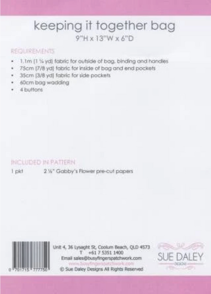 Back cover of a sewing pattern package for 'keeping it together bag' by Sue Daley Designs, showing pattern requirements, included papers, barcode, and contact information on a white background with pink borders.
Photo by Sue Daley [additional_image_link]