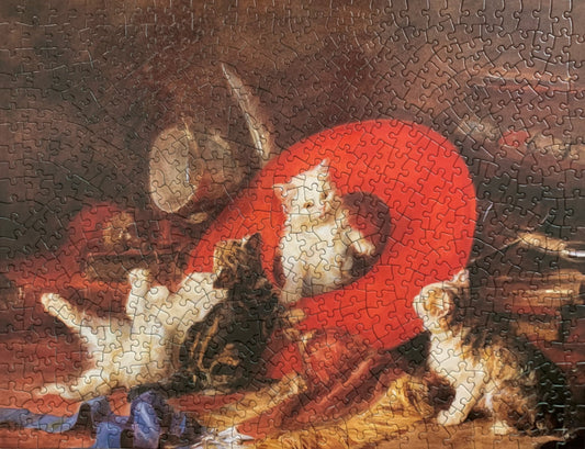 A jigsaw puzzle featuring an artistic depiction of kittens with a red sash, based on the painting by Eugene Lamberts
Photo by Karen King [image_link]