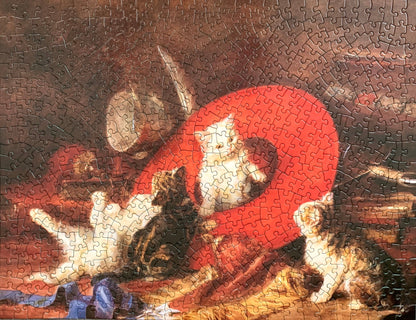 A jigsaw puzzle featuring an artistic depiction of kittens with a red sash, based on the painting by Eugene Lamberts
Photo by Karen King [additional_image_link]
