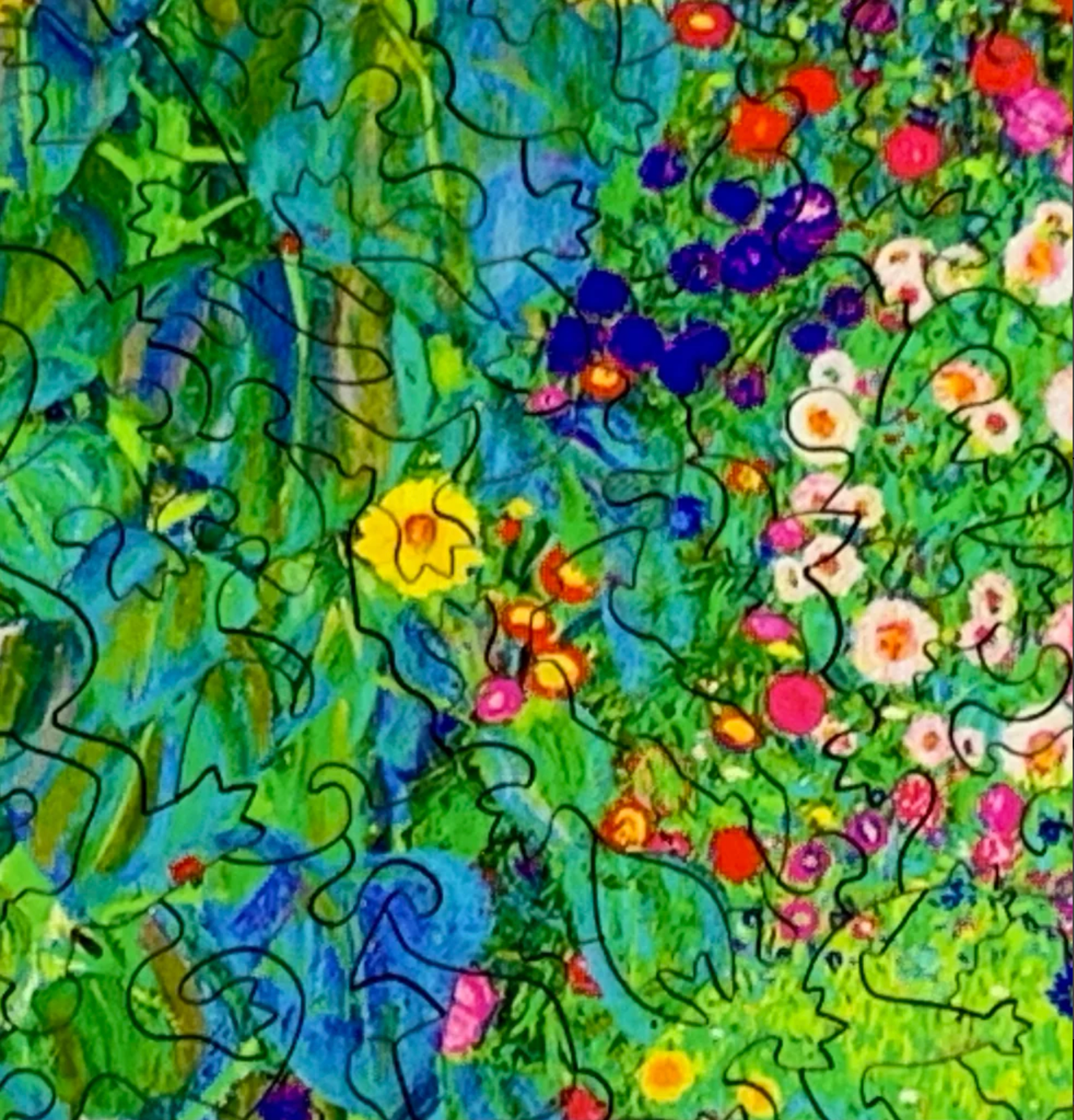 A jigsaw puzzle depicting a vibrant garden with sunflowers and various other flowers, reminiscent of Gustav Klimt's artwork.
Photo by Nautilus Puzzles [additional_image_link]