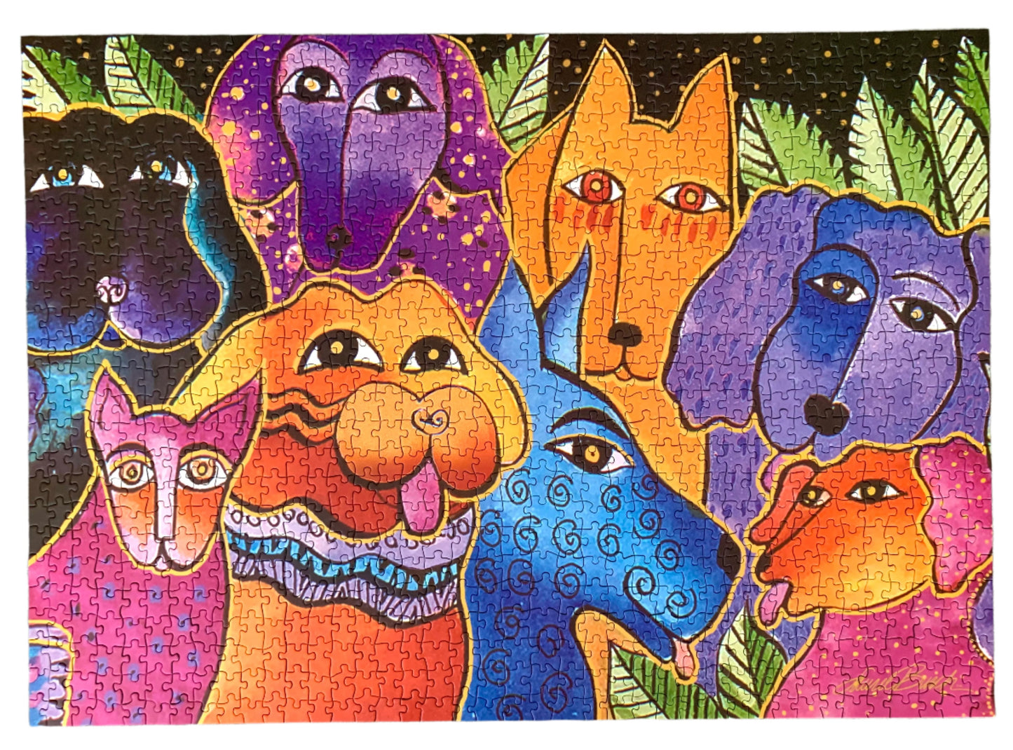 Monarque 1000-piece jigsaw puzzle box featuring a colorful, stylized illustration of various dog faces on a bright orange background.
Photo by Karen King [additional_image_link]