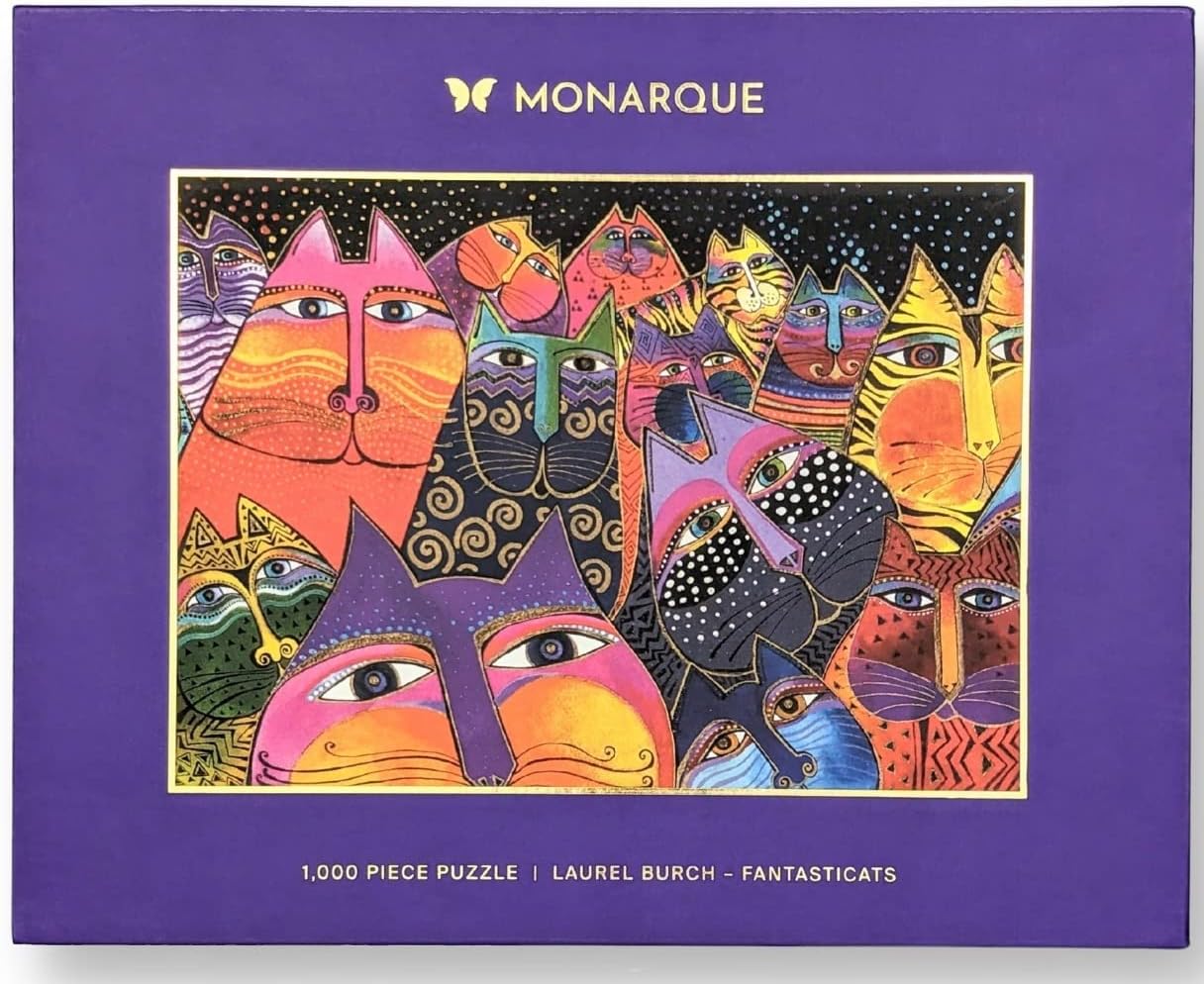 A colorful jigsaw puzzle box featuring artwork with fantastical cats, branded by Monarque.
Photo by Monarque [image_link]