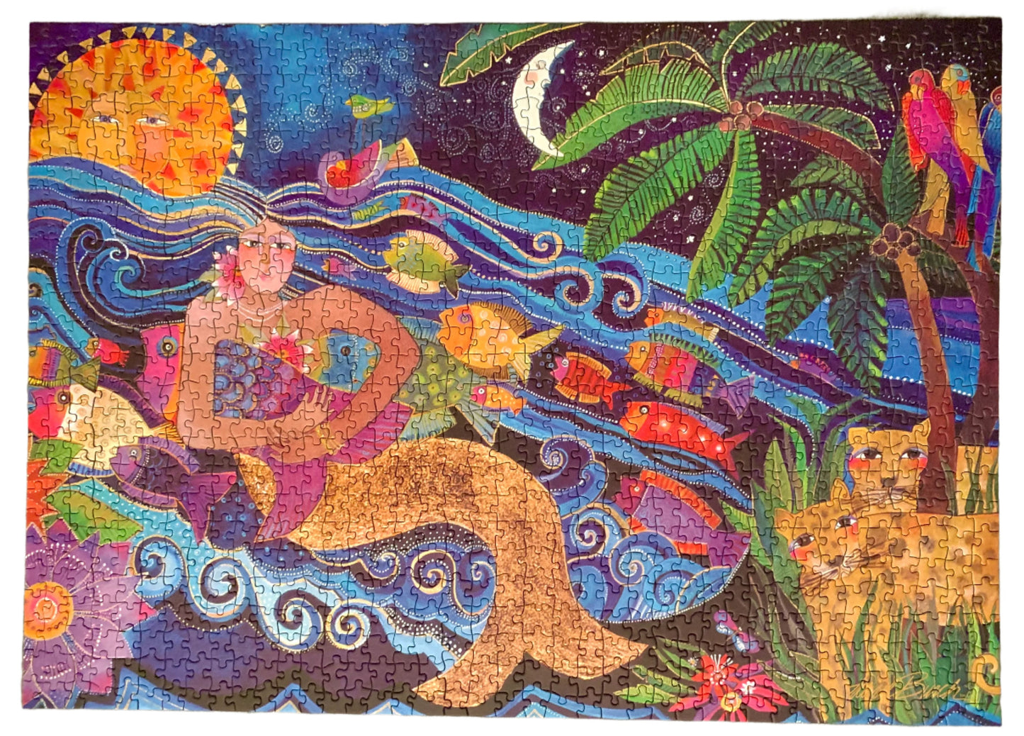 A colorful jigsaw puzzle box featuring a sea goddess design with a vibrant background and tropical elements.
Photo by Karen King [additional_image_link]