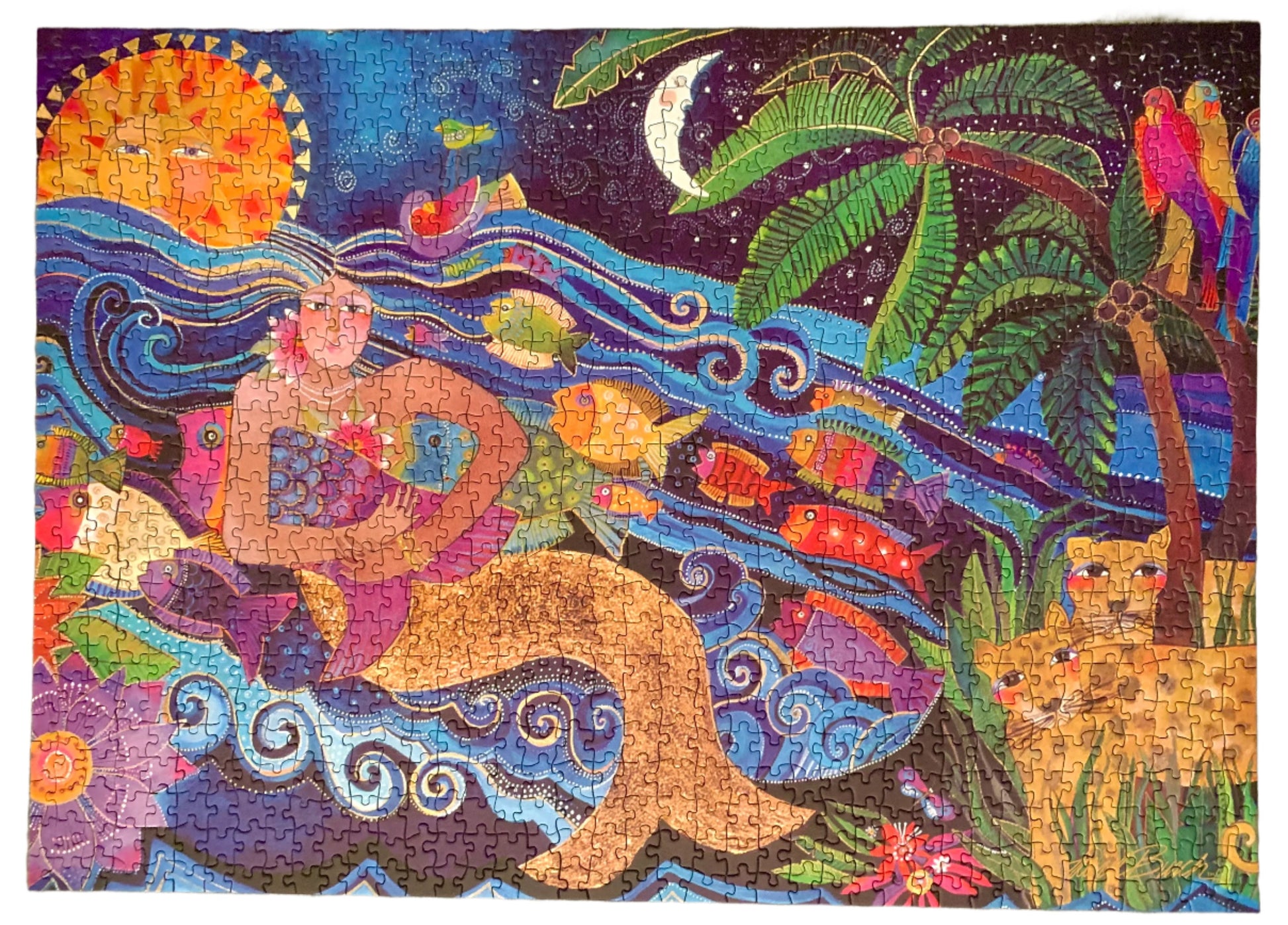 A colorful jigsaw puzzle box featuring a sea goddess design with a vibrant background and tropical elements.
Photo by Karen King [additional_image_link]