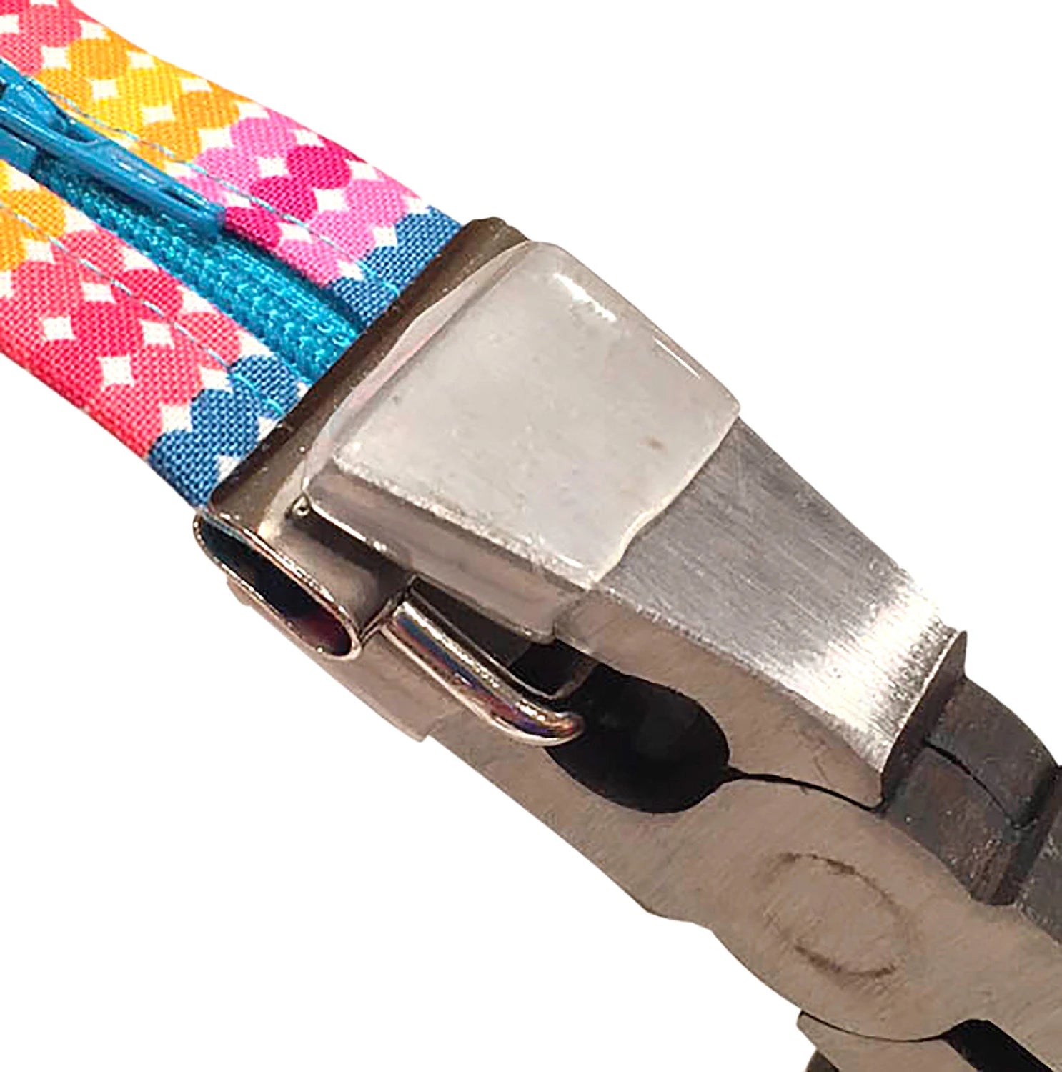 Close-up of pliers clamping a colorful woven fobio with a metal clamp on a white background.
[additional_image_link]