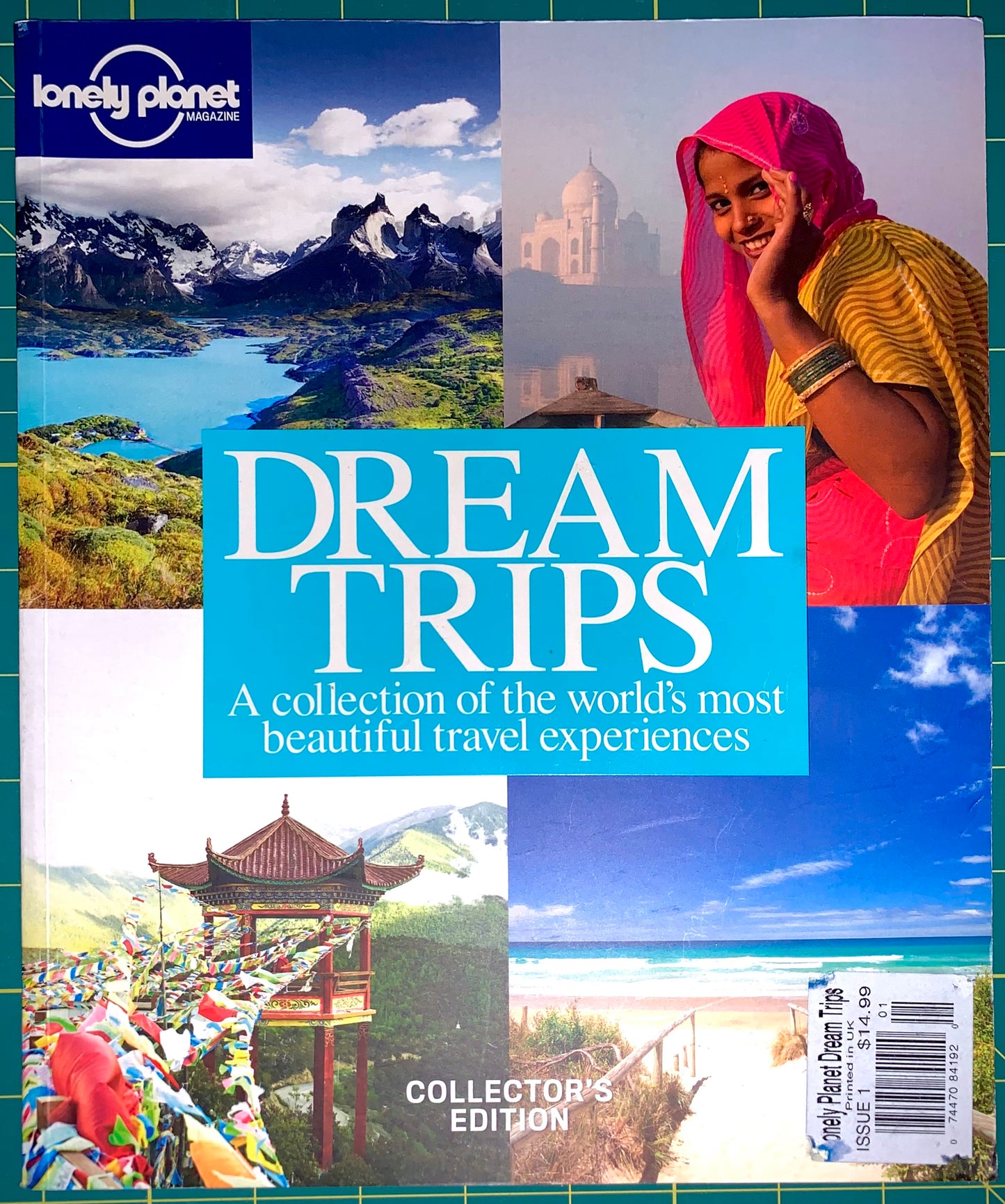 Front cover of the Lonely Planet Dream Trips Collector's Edition book, featuring a collage of travel scenes including mountains, a woman in a pink headscarf, a mosque, a pagoda, and a beach, with large white title text on a bright blue center panel.
[image_link]
