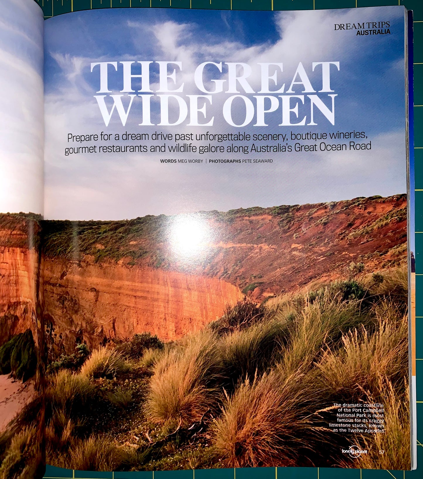 An open magazine or brochure spread showing a large scenic photograph of a canyon landscape with the headline 'THE GREAT WIDE OPEN' and smaller travel copy. The visible brand text at the top right reads 'DREAM TRIP AUSTRALIA'.
[additional_image_link]