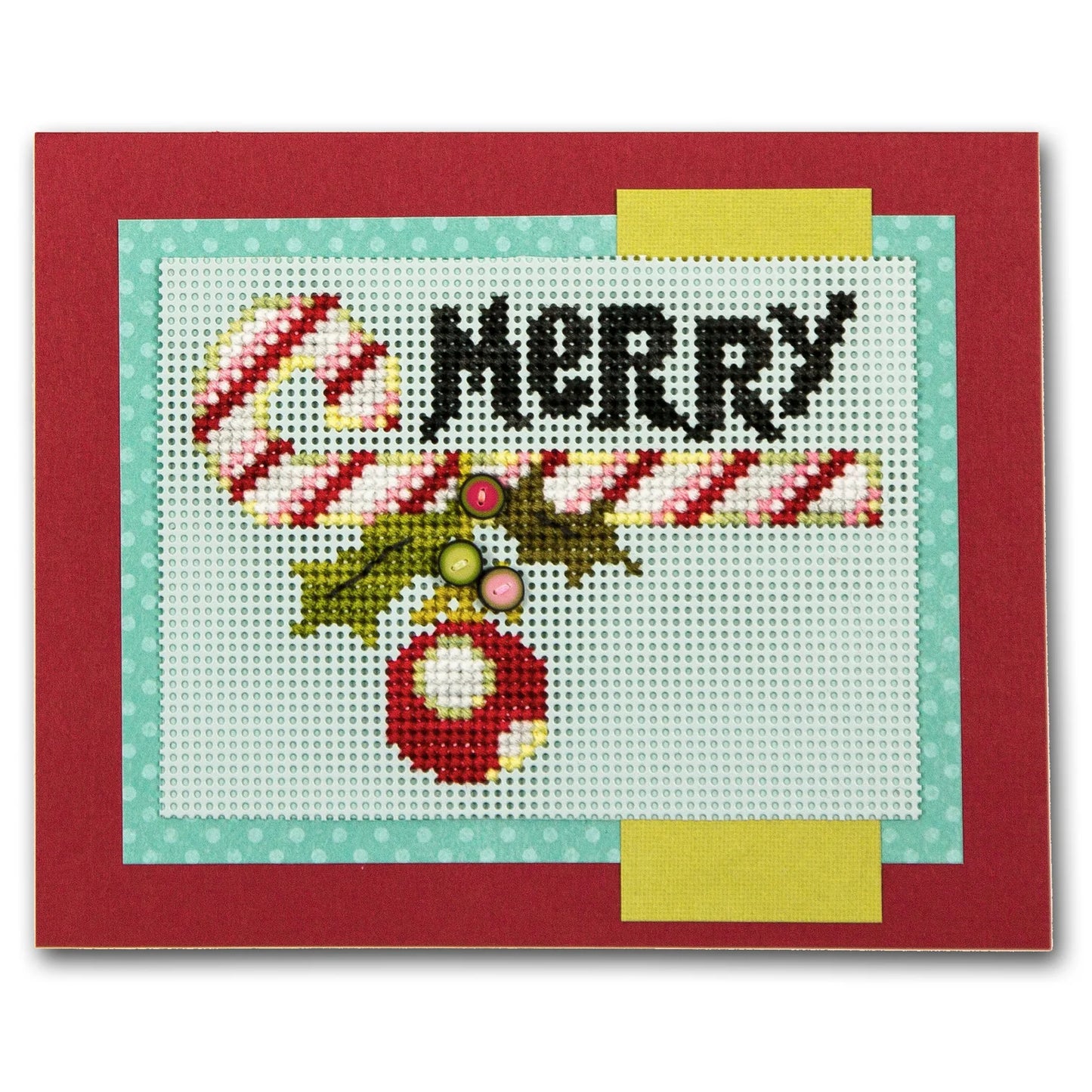 A square handmade cross-stitch card featuring a festive holiday design with the word 'MERRY' in black, a candy cane, holly leaves, and a red ornament on white stitched fabric, bordered by light blue and yellow strips and a red outer border.
Photo by JustAnotherButtonCompany.com [additional_image_link]