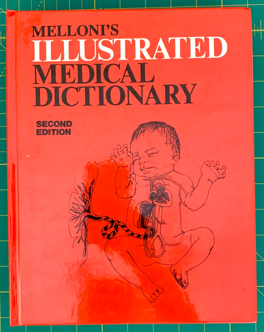Melloni's Illustrated Medical Dictionary, Second Edition, with a bright coral-red cover, bold black and white title text, and a line drawing of a fetus on the front, photographed on a green cutting mat.
[image_link]