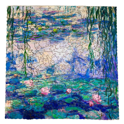 A jigsaw puzzle depicting a section of Claude Monet's famous waterlily paintings, featuring green lily pads and pink flowers in a blue pond.
Photo by Karen King [additional_image_link]