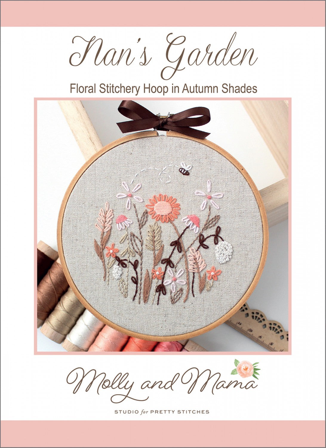 Cover of a floral stitchery hoop pattern titled 'Nan's Garden' by Molly and Mama Studio for Pretty Stitches, featuring a circular embroidery hoop with a floral design in autumn shades on a linen fabric background.
Photo by Molly and Mama [image_link]