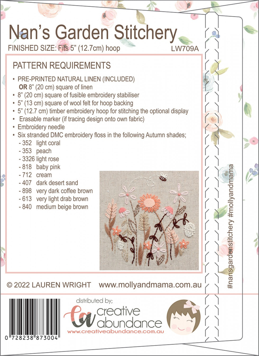 Back cover of a sewing pattern package for 'Nan's Garden Stitchery', showing pattern requirements, a sample floral embroidery design, and distribution details for Creative Abundance.
Photo by Molly and Mama [additional_image_link]