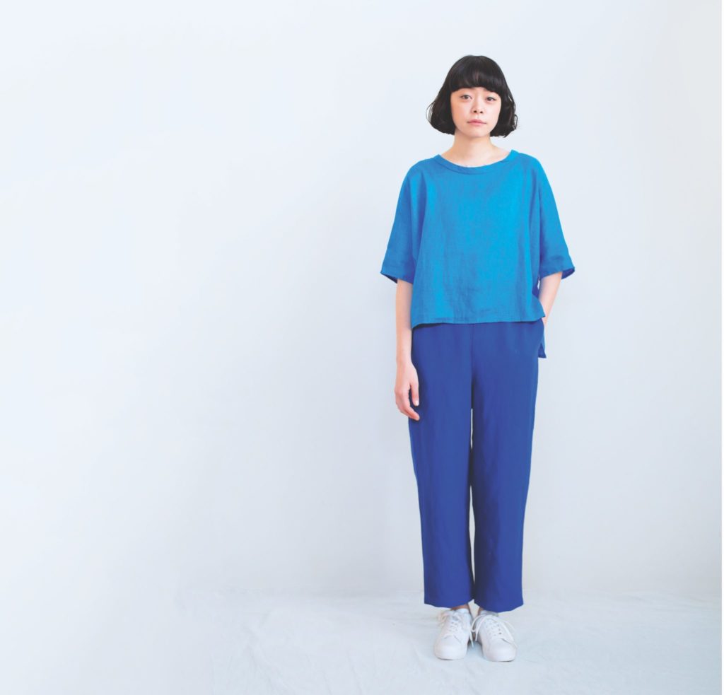 Person wearing a blue outfit on a white background.
[additional_image_link]