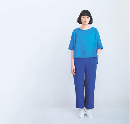 Person wearing a blue outfit on a white background.
[additional_image_link]