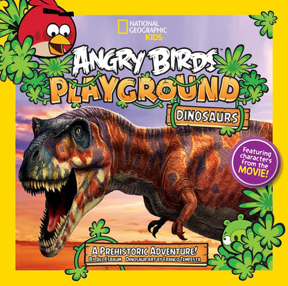 Front cover of the National Geographic Kids book 'Angry Birds Playground: Dinosaurs' featuring a large illustrated T-rex on a colorful prehistoric scene with a red Angry Birds character in the top left and green plant graphics around the border.
[additional_image_link]