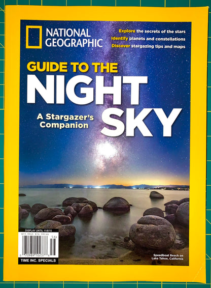 National Geographic magazine cover featuring the headline 'Guide to the Night Sky' with a night-sky landscape photo and rocky shoreline, framed by the signature yellow border.
[image_link]
