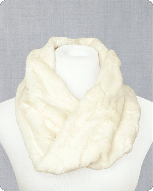 A fluffy cream faux-fur infinity scarf draped on a white mannequin torso against a light gray textured background.
Photo by Shannon Fabrics [image_link]
