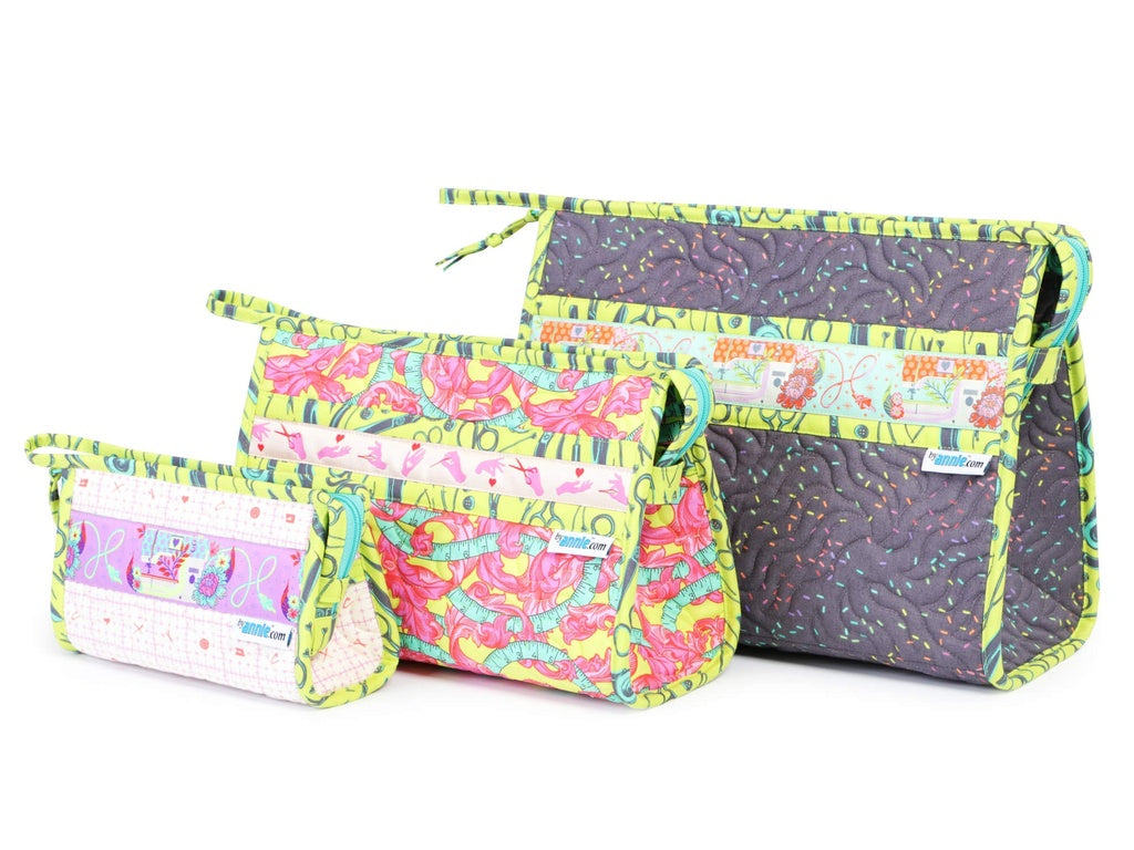 Three colorful fabric bags with floral and polka dot patterns on a white background.
Photo by Annie [additional_image_link]