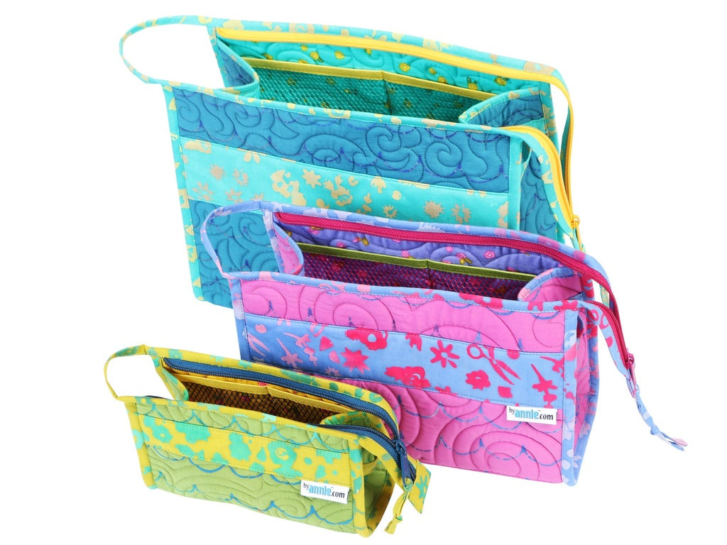 Set of colorful fabric pouches with floral patterns on a white background.
Photo by Annie [additional_image_link]