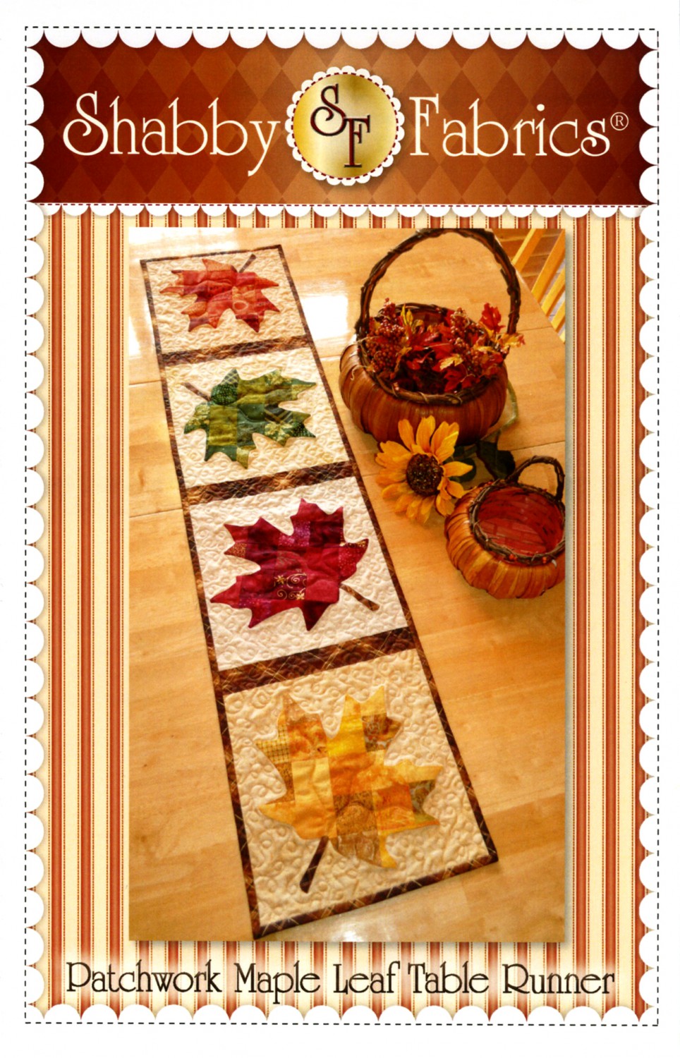 A patchwork maple leaf table runner pattern from Shabby Fabrics displayed on a table with fall-themed decorations around it.
Photo by Shabby Fabrics [image_link]