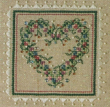 A cross stitch embroidery kit packaging from The Sweetheart Tree featuring a heart-shaped design with floral patterns.
Photo by The Sweetheart Tree [additional_image_link]