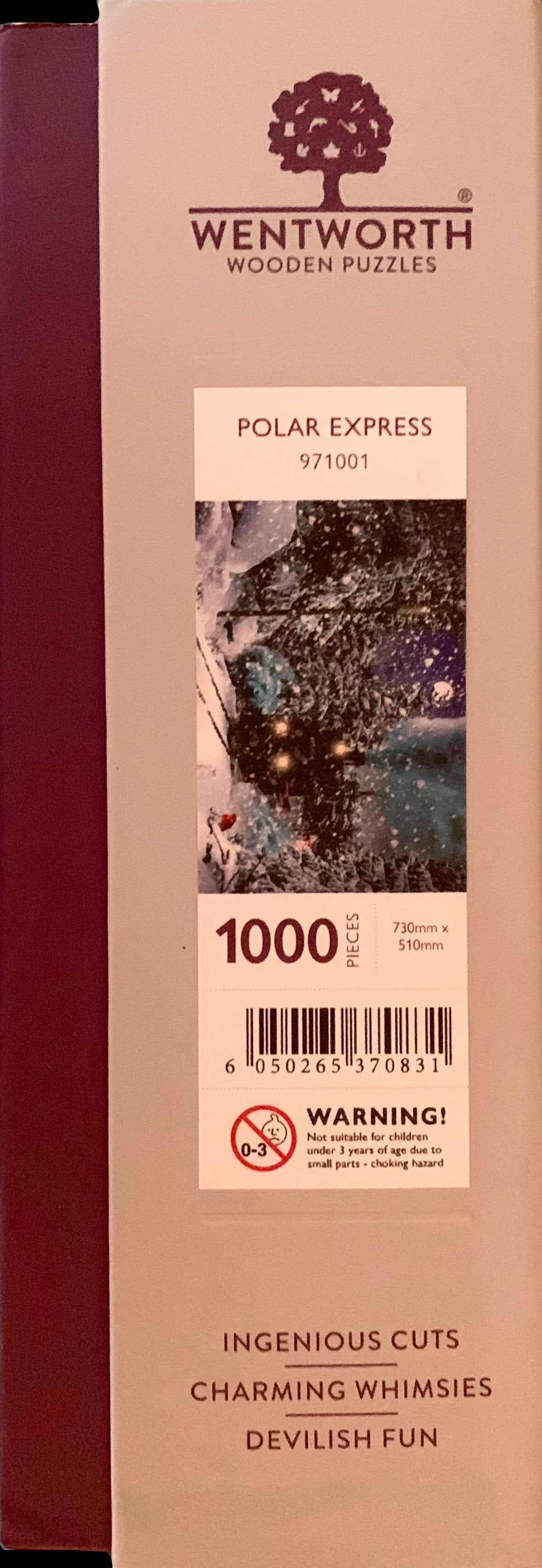 A pre-owned wooden jigsaw puzzle depicting a scene with a train and snow-covered trees, with puzzle pieces scattered around.
Photo by Karen King [additional_image_link]