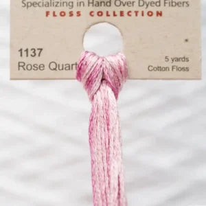 Rose Quartz floss tied in a knot with a label in the background.
