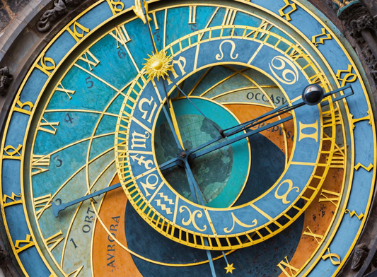 A completed wooden jigsaw puzzle depicting the Prague Astronomical Clock, with a richly colored design and various time-keeping elements.
Photo by Nautilus Puzzles [image_link]