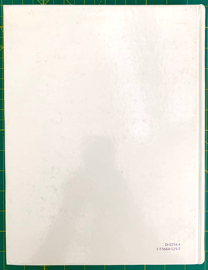 A white rectangular back book cover with a glossy finish, photographed from above on a green cutting mat. Small printed alphanumeric text appears in the bottom-right corner of the sheet.
[additional_image_link]