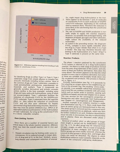 An open book showing a printed page with text, a small orange-and-blue wavelength graph, and a reaction-product table, photographed indoors with natural light.
[additional_image_link]