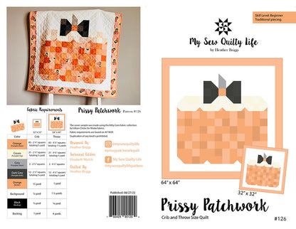 A quilt pattern cover and layout sheet for 'Prissy Patchwork' by Heather Briggs, showing a finished patchwork quilt with orange and cream checkered sections, black bow details, fabric requirements, and size options 64x64 and 32x32.
Photo by My Sew Quilty Life [image_link]